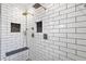 This tiled shower features a rainfall showerhead and built in bench and shelving at 5258 Mulholland Dr, Summerville, SC 29485