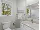 Cozy bathroom featuring gray walls, granite counters, a shower/bath combo, and a toilet at 55 Fairway Dunes Ln, Isle of Palms, SC 29451