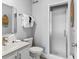 Cozy bathroom features a shower with glass doors, gray walls, and a granite vanity sink at 55 Fairway Dunes Ln, Isle of Palms, SC 29451