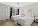 Bright bedroom featuring two twin beds, neutral walls, and access to a balcony with outdoor views at 55 Fairway Dunes Ln, Isle of Palms, SC 29451