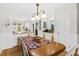 Inviting dining area with a chandelier and views to the outdoor patio at 55 Fairway Dunes Ln, Isle of Palms, SC 29451