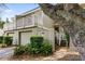 Charming townhouse featuring a private garage, inviting staircase, and an elevated deck with white railings at 55 Fairway Dunes Ln, Isle of Palms, SC 29451