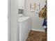 Laundry room with side by side washer and dryer, bulletin board, and tile floors at 55 Fairway Dunes Ln, Isle of Palms, SC 29451