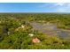 Picturesque aerial shot showcasing a waterfront property, surrounded by lush greenery and meandering waterways at 554 Parrot Point Dr, Charleston, SC 29412