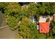 Aerial view showcasing a home with a pool, surrounded by lush greenery and a waterway at 554 Parrot Point Dr, Charleston, SC 29412