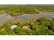 A beautiful home nestled among the trees with waterfront access and a private dock at 554 Parrot Point Dr, Charleston, SC 29412