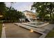 Expansive backyard oasis featuring a bocce ball court, swimming pool, and lush landscaping for luxurious outdoor living at 554 Parrot Point Dr, Charleston, SC 29412
