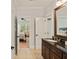 Ensuite bathroom with granite counters, tile flooring, and a stylish mirror offers a touch of elegance at 554 Parrot Point Dr, Charleston, SC 29412