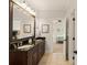 Bathroom featuring dual sinks, granite countertops, and tile flooring offers convenience and style at 554 Parrot Point Dr, Charleston, SC 29412