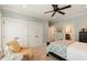 Bedroom featuring a comfortable bed, ceiling fan, neutral tones, and a private bath for added convenience at 554 Parrot Point Dr, Charleston, SC 29412
