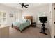 Cozy bedroom with a ceiling fan, natural light, and comfortable furniture is perfect for relaxation at 554 Parrot Point Dr, Charleston, SC 29412