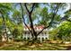Charming two-story home with a red roof and a sprawling front yard at 554 Parrot Point Dr, Charleston, SC 29412