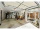Spacious garage interior featuring storage racks, shelving, a utility sink, and stairs at 554 Parrot Point Dr, Charleston, SC 29412