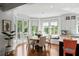 Open kitchen with island seating and a breakfast nook with backyard views at 554 Parrot Point Dr, Charleston, SC 29412