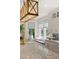 Bright kitchen features a granite countertop, window seat, and designer lighting at 554 Parrot Point Dr, Charleston, SC 29412