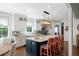 Bright kitchen boasts a large island with seating, stylish lighting, and modern amenities, perfect for cooking and entertaining at 554 Parrot Point Dr, Charleston, SC 29412