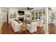 Cozy living room with fireplace, built-ins, and stylish coastal furnishings at 554 Parrot Point Dr, Charleston, SC 29412