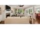 Bright and airy living room with a fireplace, stylish furnishings, and large windows offering great outdoor views at 554 Parrot Point Dr, Charleston, SC 29412