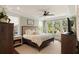 Serene main bedroom with a tray ceiling, large windows, and neutral decor at 554 Parrot Point Dr, Charleston, SC 29412