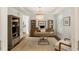 Bright office with hardwood floors, stylish chandelier, built-in shelves, and a modern work space at 554 Parrot Point Dr, Charleston, SC 29412