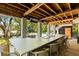 Spacious outdoor kitchen area with a long bar, perfect for entertaining by the pool and enjoying outdoor living at 554 Parrot Point Dr, Charleston, SC 29412