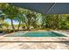 Refreshing pool with lounge chairs and a scenic backyard view offers the perfect outdoor retreat at 554 Parrot Point Dr, Charleston, SC 29412
