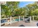 A relaxing view of the pool and yard from the wood paneled deck at 554 Parrot Point Dr, Charleston, SC 29412