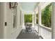 Cozy porch with a rocking chair and blue ceiling at 554 Parrot Point Dr, Charleston, SC 29412