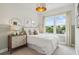 Inviting bedroom with natural light, a comfortable bed, stylish dresser, and decorative accents at 566 Scholar Way, Summerville, SC 29486