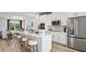 Well-equipped kitchen with a large island, stainless steel appliances, and ample cabinet space at 566 Scholar Way, Summerville, SC 29486