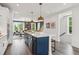 Bright, modern kitchen featuring a large island with seating and contemporary pendant lights at 566 Scholar Way, Summerville, SC 29486