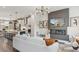 Bright living room with a modern fireplace and an open view of the kitchen at 566 Scholar Way, Summerville, SC 29486