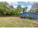 Large backyard with a wooden fence, grass, and plenty of room to play at 6146 Chisolm Rd, Johns Island, SC 29455