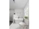Bright bathroom showcasing a sleek standalone tub next to a window and modern toilet at 6146 Chisolm Rd, Johns Island, SC 29455