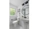 Chic bathroom with pedestal sink, modern fixtures, and natural light at 6146 Chisolm Rd, Johns Island, SC 29455