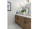 Bright bathroom features a double sink vanity with modern fixtures and round mirrors at 6146 Chisolm Rd, Johns Island, SC 29455