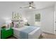 Cozy bedroom features a ceiling fan, natural light, and decorative accents at 6146 Chisolm Rd, Johns Island, SC 29455