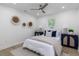 Cozy bedroom with wood floors, a comfortable bed, and ample lighting at 6146 Chisolm Rd, Johns Island, SC 29455