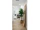 Hallway featuring a full-length mirror, hardwood floors, and bright natural light at 6146 Chisolm Rd, Johns Island, SC 29455