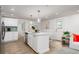 Modern kitchen with an island, stainless steel appliances, and quartz countertops at 6146 Chisolm Rd, Johns Island, SC 29455