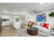 Bright living room with modern decor, stylish furniture, and open kitchen at 6146 Chisolm Rd, Johns Island, SC 29455