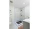 This shower features marble and dark tile, as well as bronze trim at 6146 Chisolm Rd, Johns Island, SC 29455