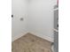 Utility Room featuring wood-look vinyl flooring and plumbing and electrical outlets at 6146 Chisolm Rd, Johns Island, SC 29455