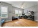 Well-lit room featuring wood floors, light gray walls, and multiple windows at 626 Windermere Blvd # 4D, Charleston, SC 29407