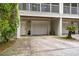 Attached one car garage and entry door offers convenient parking and access to the home at 626 Windermere Blvd # 4D, Charleston, SC 29407