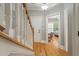 Hallway with hardwood floors leading to front door and bedroom at 626 Windermere Blvd # 4D, Charleston, SC 29407