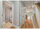 Hallway with hardwood floors leading to bathroom and living area at 626 Windermere Blvd # 4D, Charleston, SC 29407