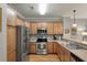 Well-lit kitchen with stainless appliances and hardwood floors at 626 Windermere Blvd # 4D, Charleston, SC 29407
