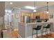 Open concept kitchen with stainless steel appliances and bar seating at 626 Windermere Blvd # 4D, Charleston, SC 29407