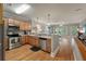 Open concept kitchen with stainless steel appliances and wood cabinets at 626 Windermere Blvd # 4D, Charleston, SC 29407